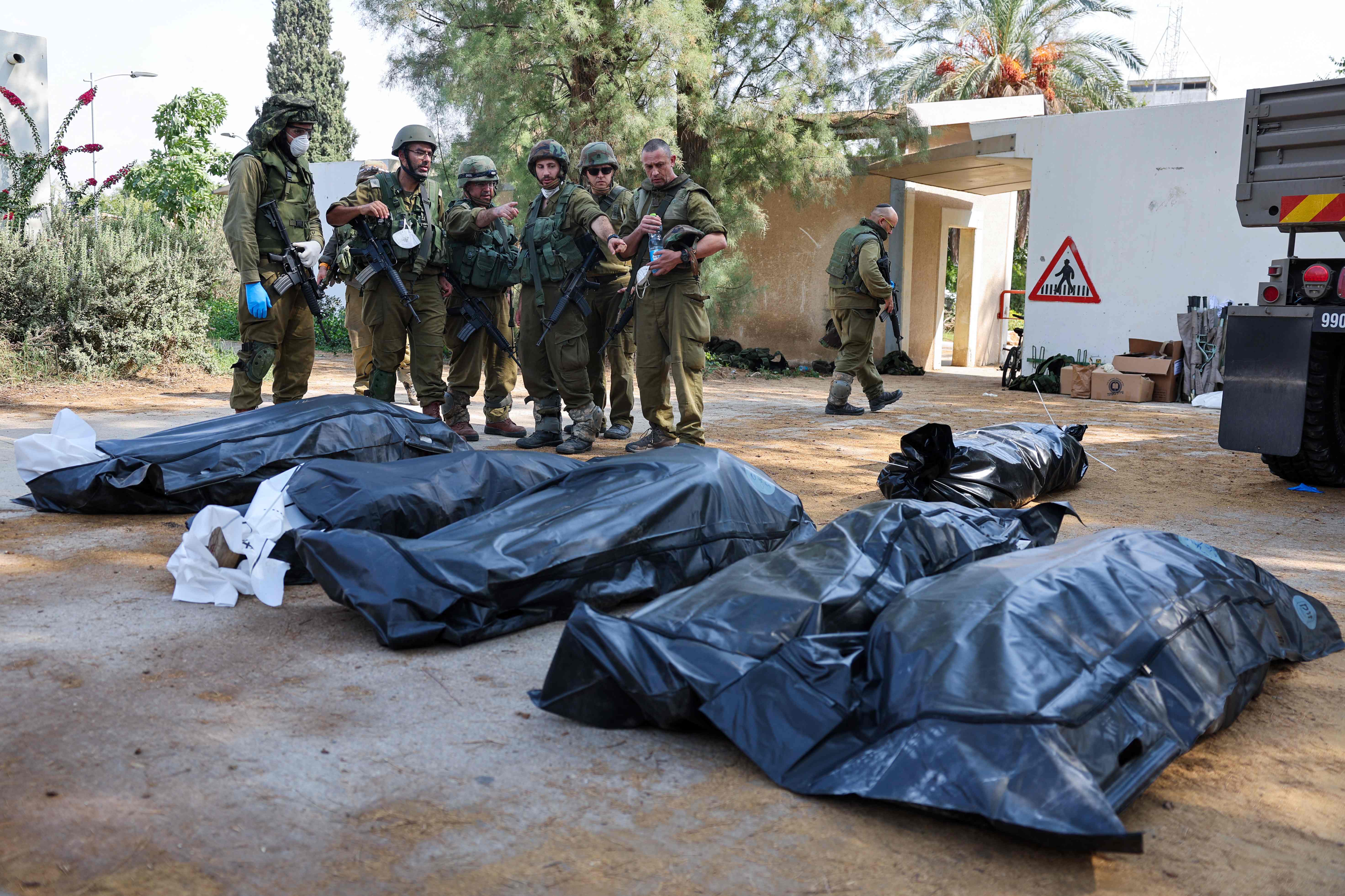 Entire families were gunned down by Hamas militants in Kfar Aza - a village close to the Gaza border