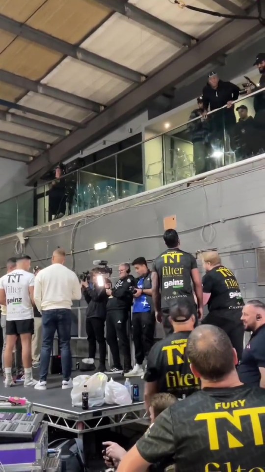 KSI was standing on a balcony about John Fury