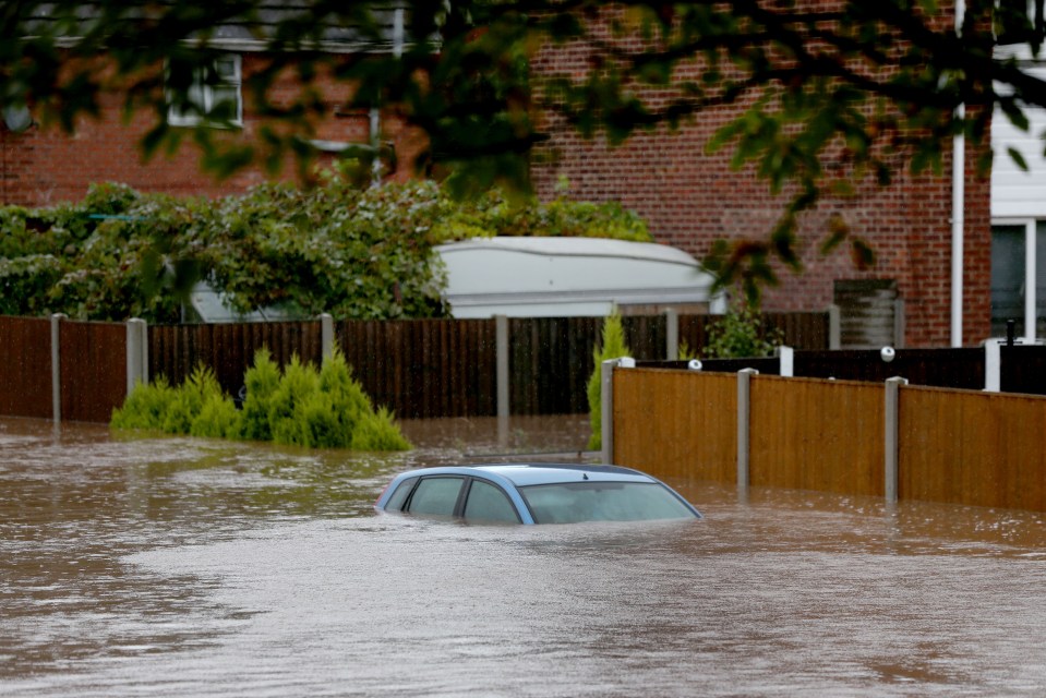 A car is almost completely submerged in Hucknall, Nottinghamshire