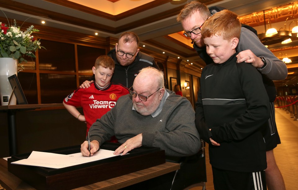 Fans lined up to sign a book of condolences