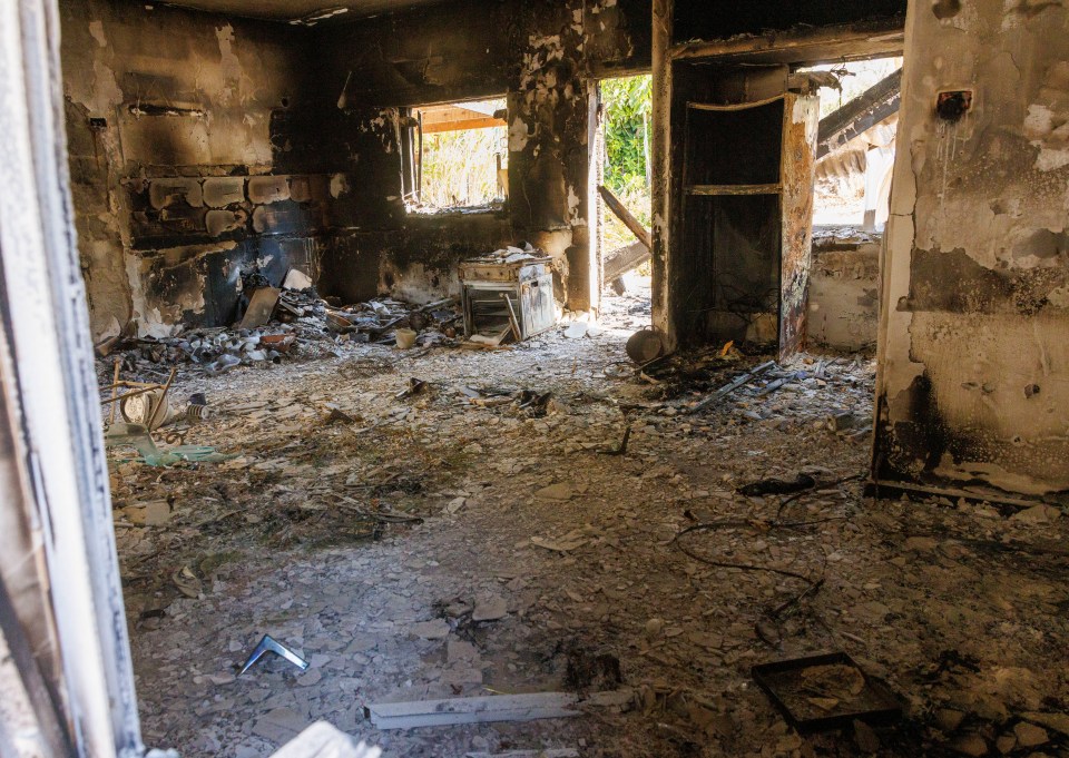 Charred remains of people's homes after they were burned down by the terror group