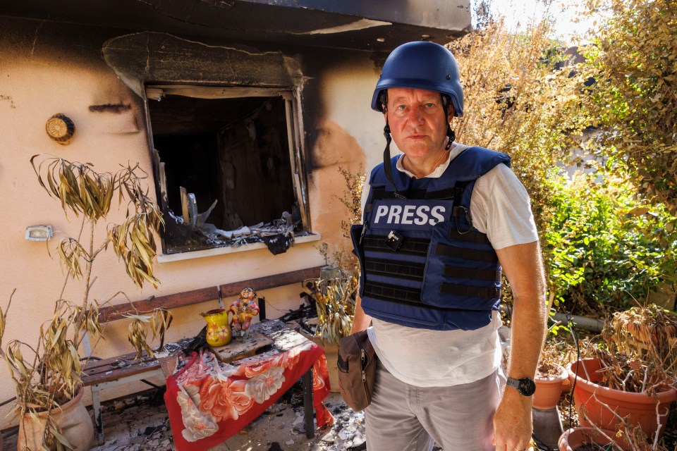 Sun man Nick Parker at one of the ransacked and burnt homes in the Nir Oz Kibbutz