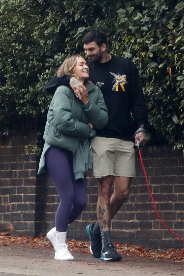 The couple were all smiles on their stroll