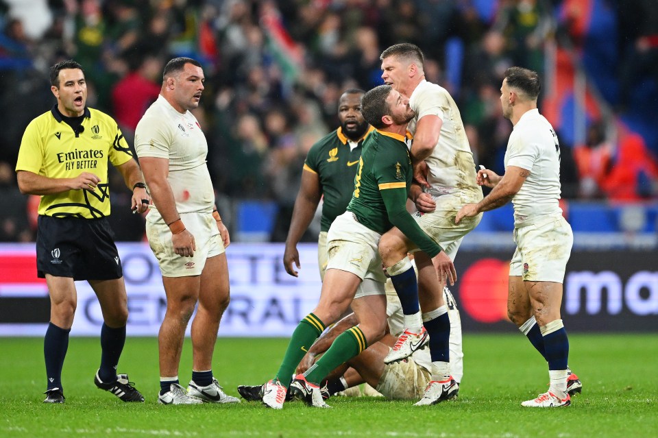 The pair tussled in the middle of the pitch after the full-time whistle