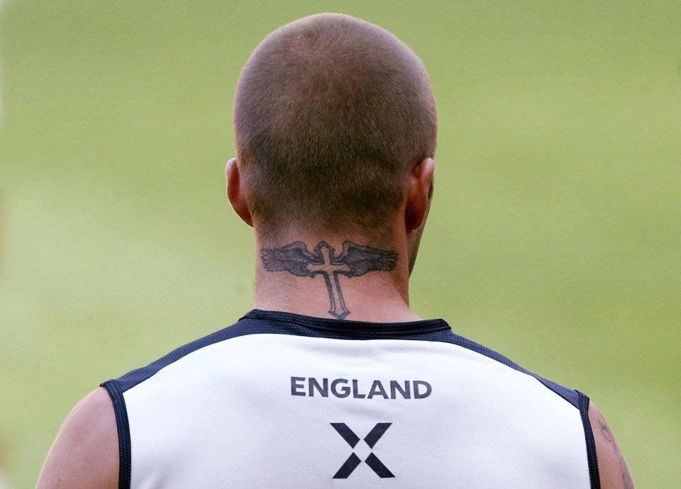 Beckham's most famous tattoos is on his neck, which is a gothic style cross and wings