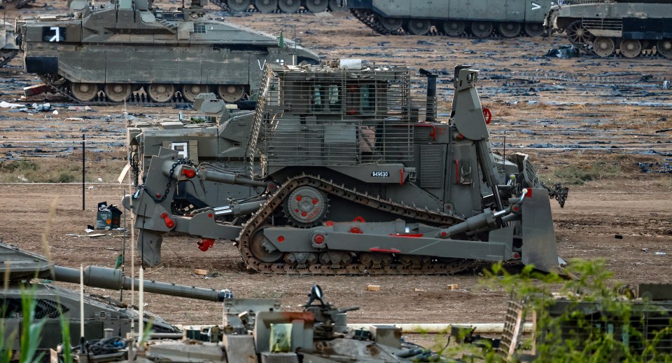 Israeli soldiers prepare for the scenario of ground maneuvers at an undisclosed location near the border with Gaza