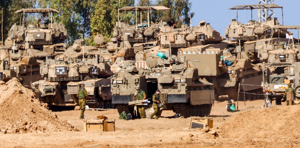 Israel has massed tanks and soldiers near the Gaza border ahead of an invasion