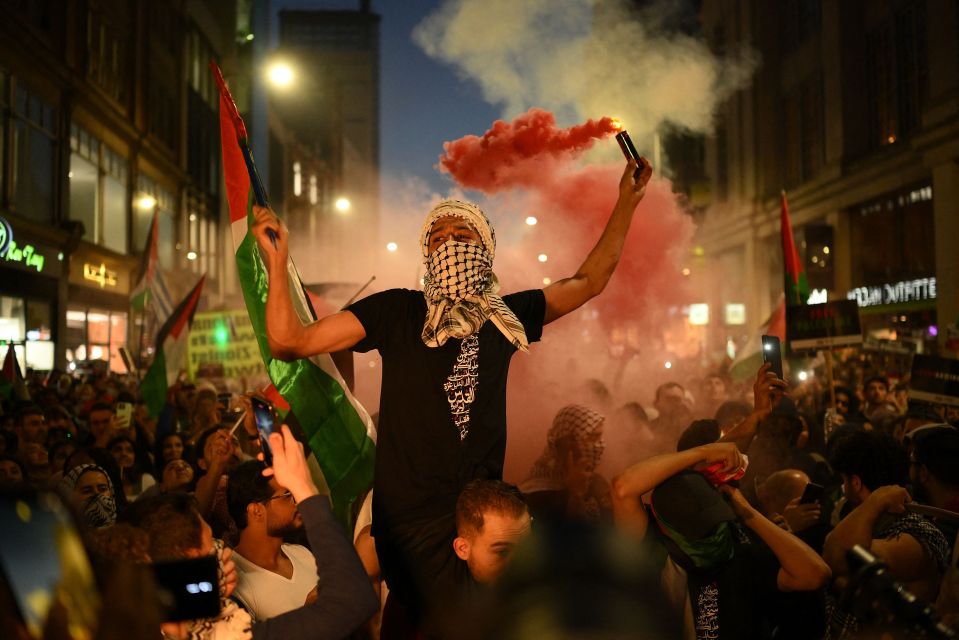 The Home Secretary has warned that anti-Israeli chants and flag-waving could result in police action