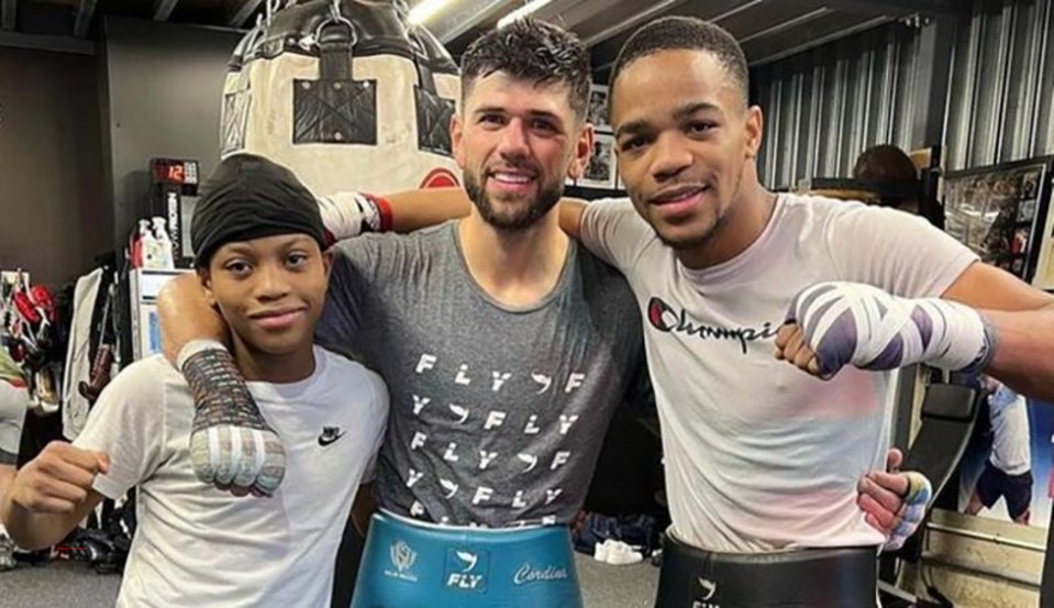 Soloh Defreitas and Yash pose with sparring partner Joe Cordina