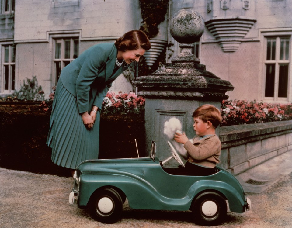 Three-year-old Charles was photographed in a pedal-car at Balmoral with The Queen in 1953