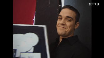 Robbie looks back at his career through video footage