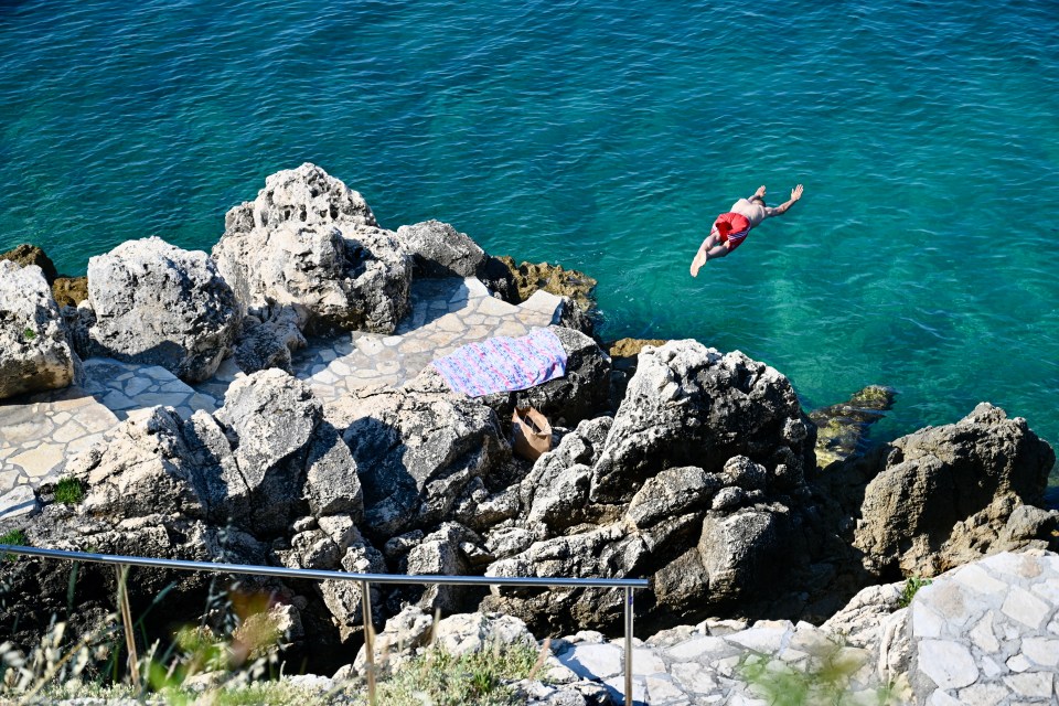 Rock diving off the coastline