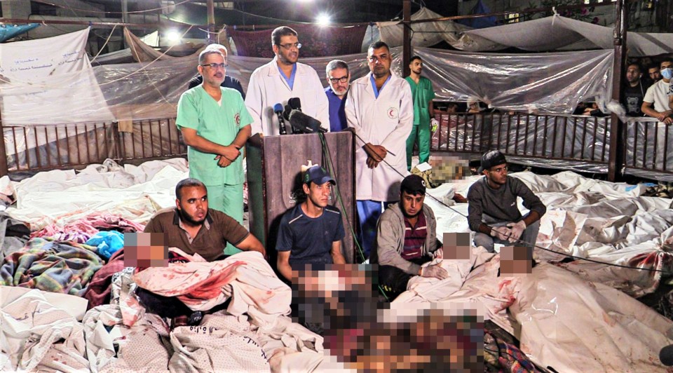 Doctors were seen cradling babies in the aftermath of the hospital explosion