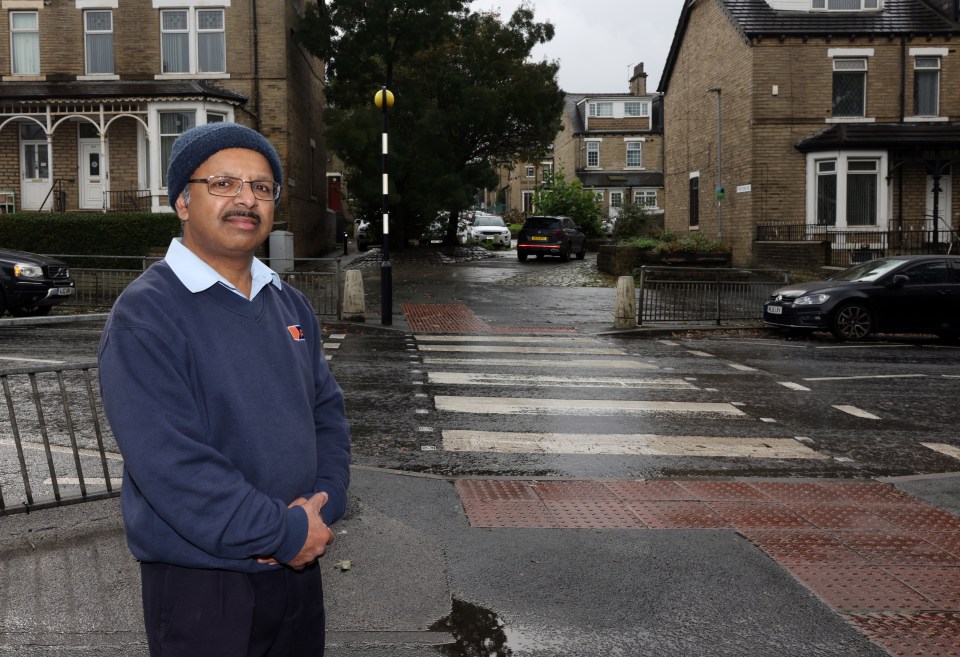 Disabled peoples' escort Abdul Sattar, 56, having just used the zebra crossing