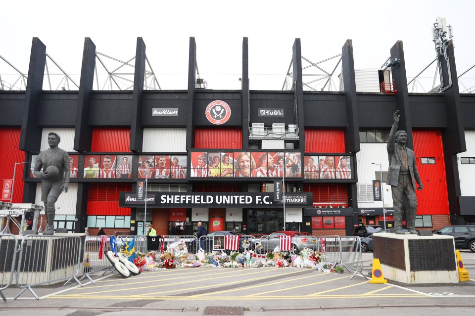 Floral tributes, shirts and written messages outside Bramall Lane following her death