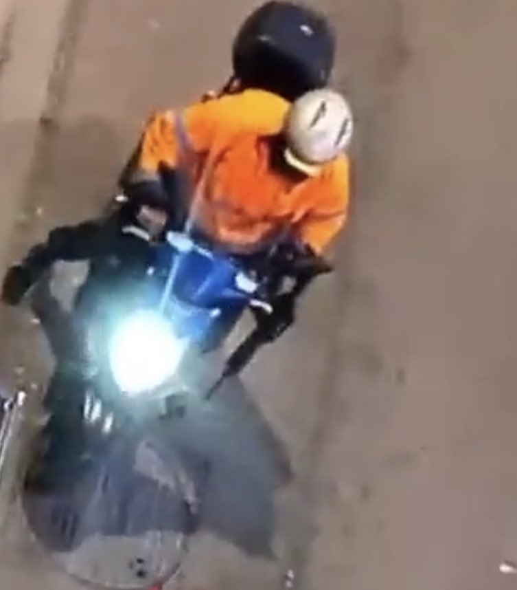 The gunman was seen riding a motorbike in a bright orange jacket