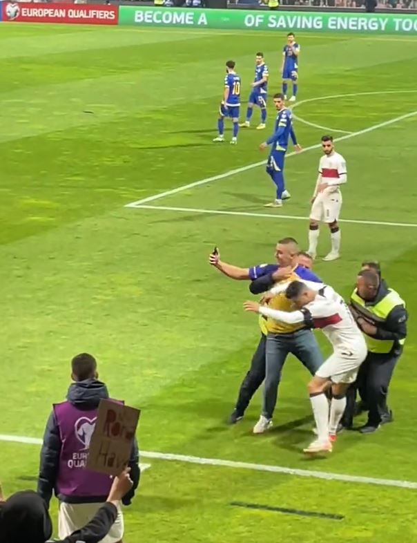 The fan clipped Ronaldo's right boot as he tried to take a selfie with the superstar