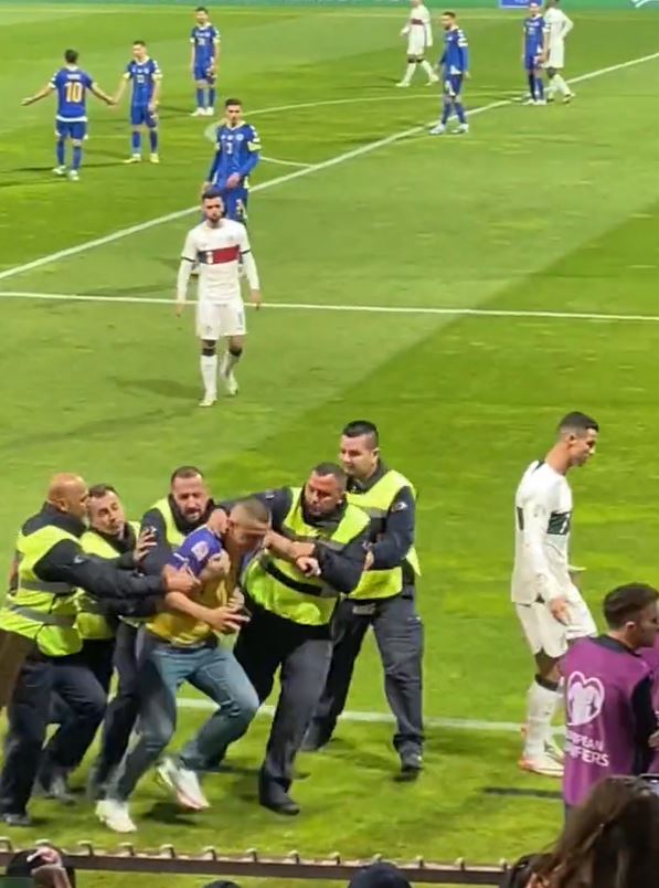 Security managed to escort the fan off the pitch