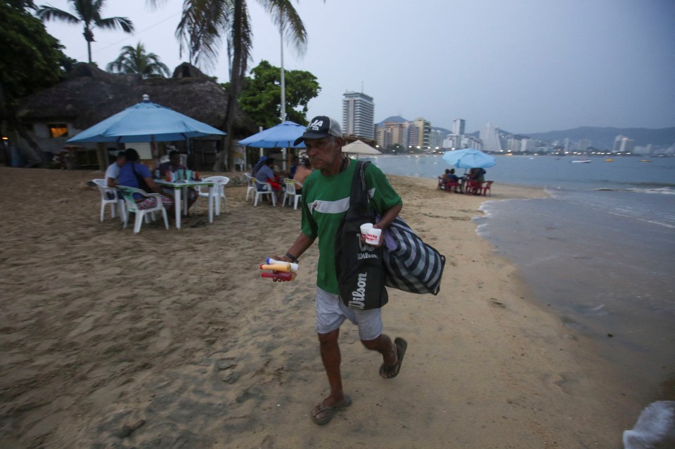 Heavy rains descend on Mexico’s southern coastal communities ahead of Otis’ landfall