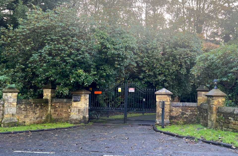 The house is hidden behind black gates