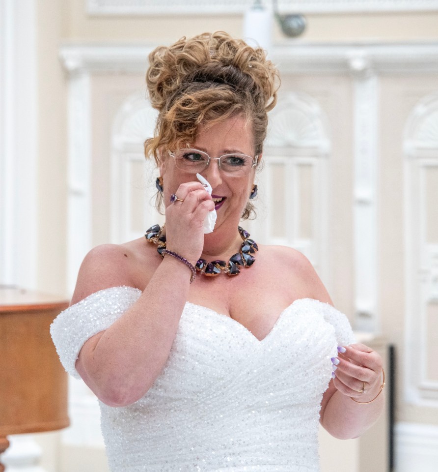 Sarah is overcome with emotion and sheds a tear as she marries herself