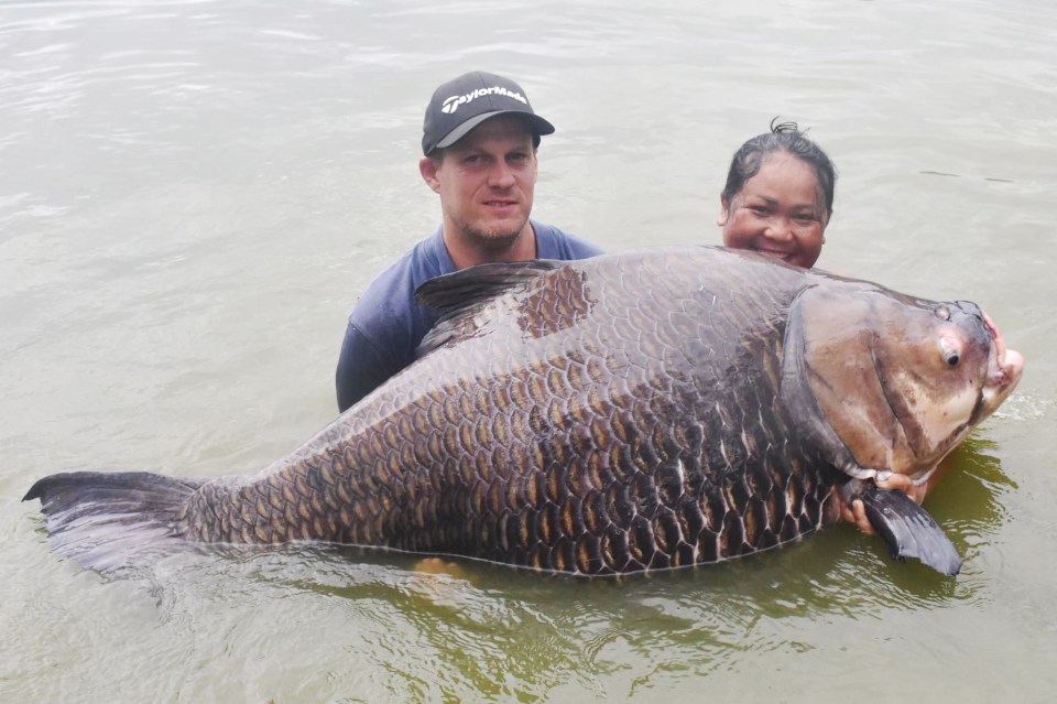 Kelvin Marston spent nine hours waiting for the monster before reeling it in at a lake in Thailand