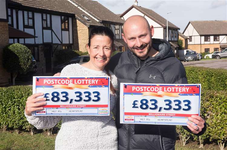 Ashley and his mum Tania show off their winnings