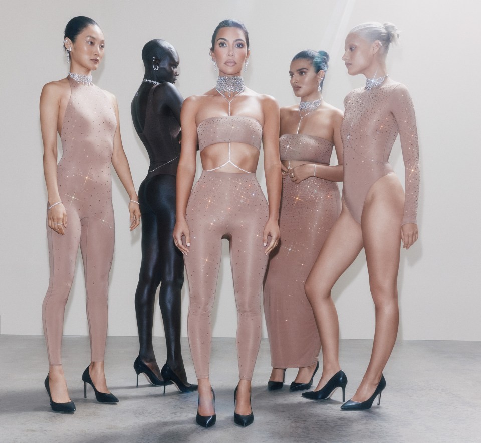 Kim happily posed alongside fellow models as she promoted her new line