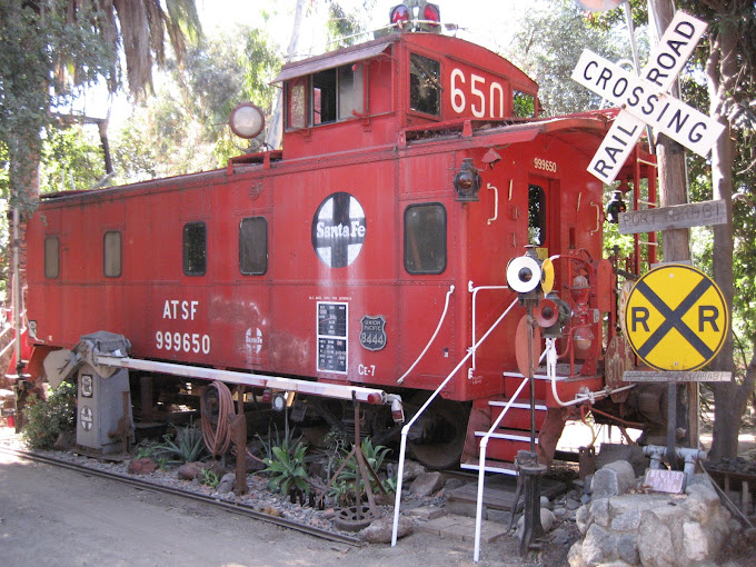 A restored Santa Fe caboose is a more obscure vehicle at the castle