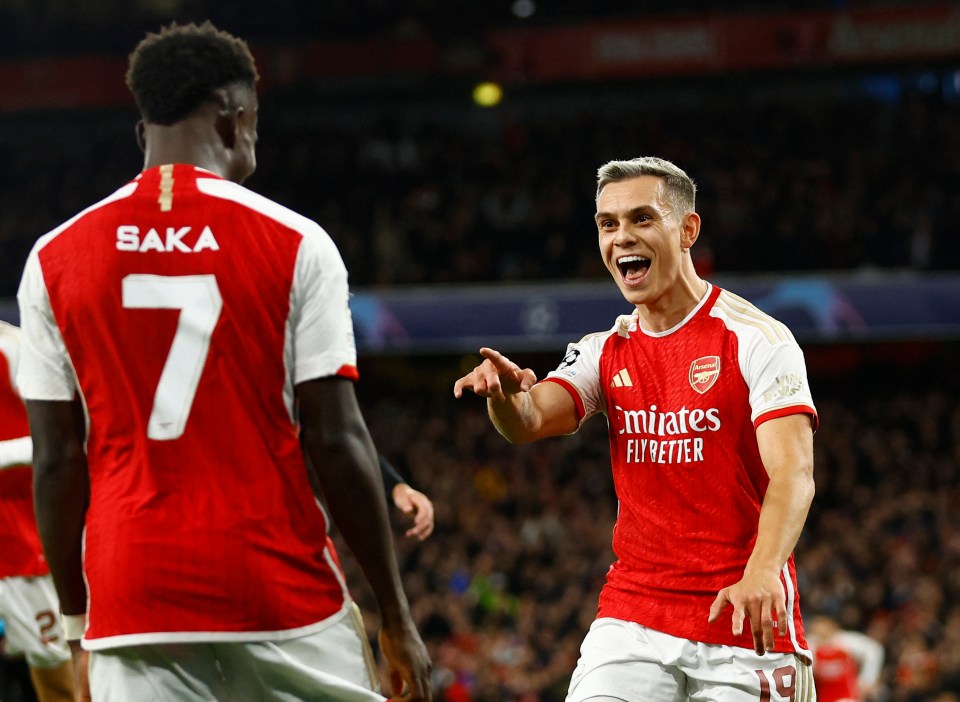 The Belgian celebrates with Bukayo Saka