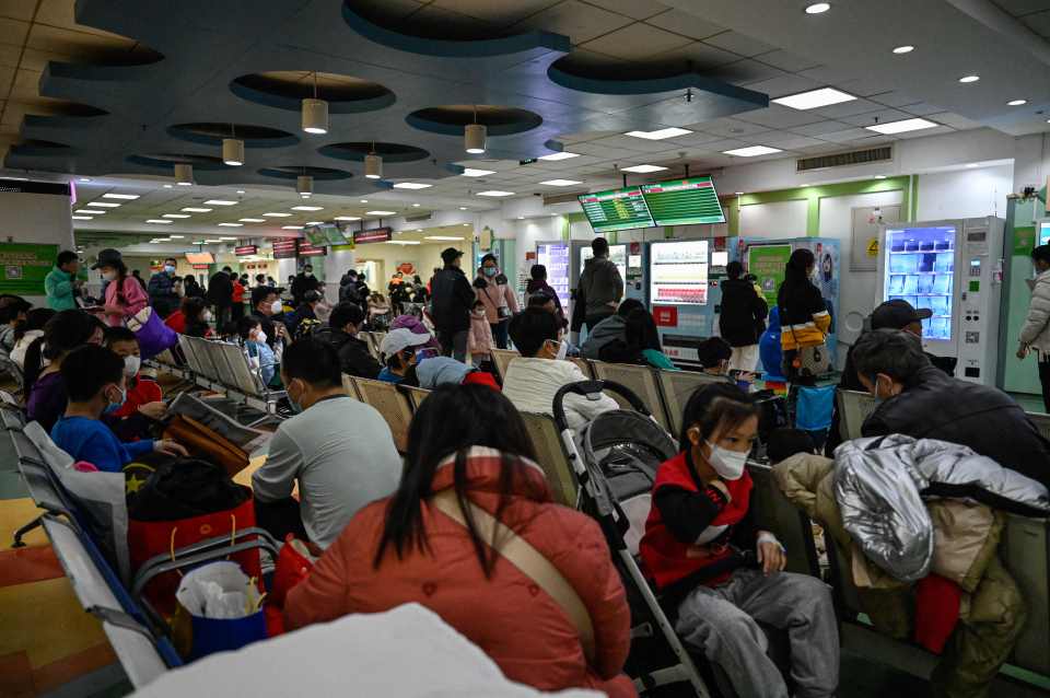 Children and their parents waiting at a children's hospital in Beijing in 2023