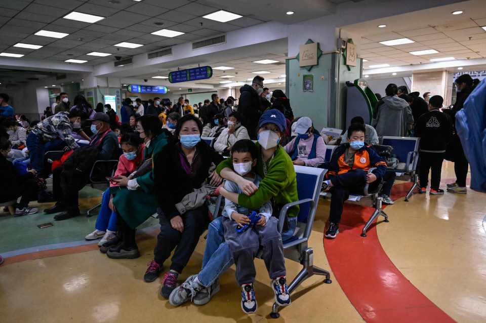 Alarming footage has emerged of mask-wearing crowds inside Chinese hospitals as fears of a new pandemic sweep across the globe