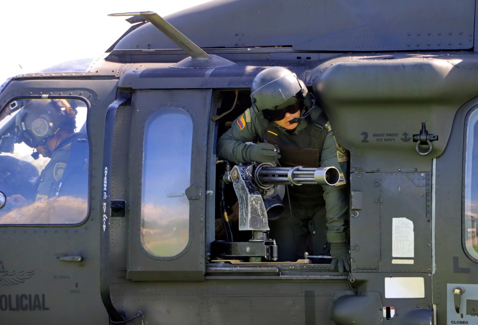 Police and military arrive in Black Hawk helicopters after leaving the Perija mountain range where Luis Manuel Diaz is presumed to have been taken