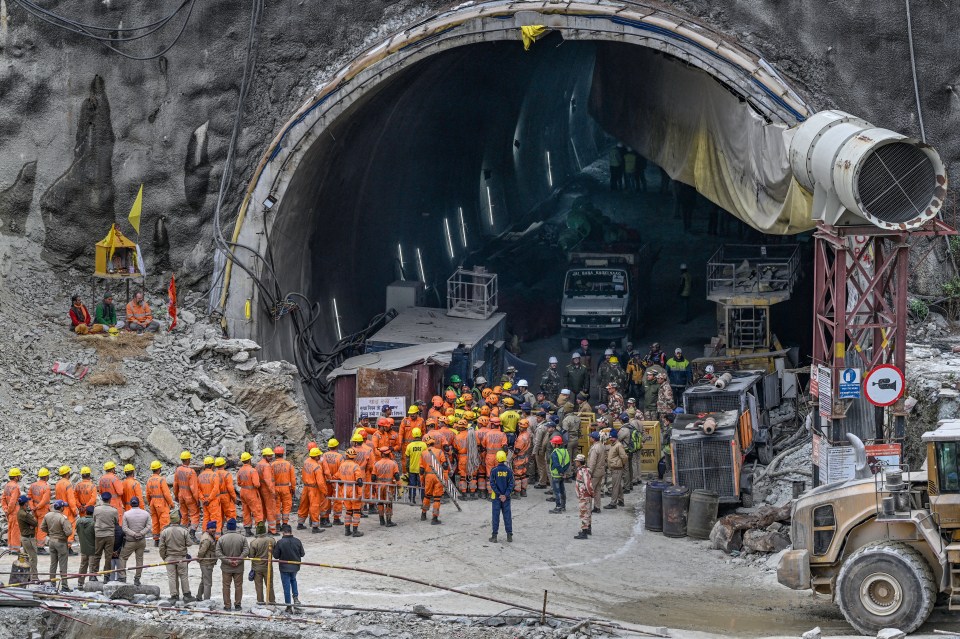 Rescuers pull out the first of 41 construction workers stuck inside a collapsed tunnel for more than two weeks