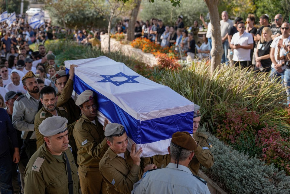 IDF soldiers carry the coffin of a soldier who died during Hamas' attacks on Israel