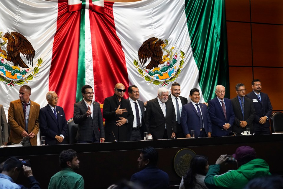 Mexican Journalist Jaime Maussan, centre, and legislators present the 'non-human' bodies on Tuesday