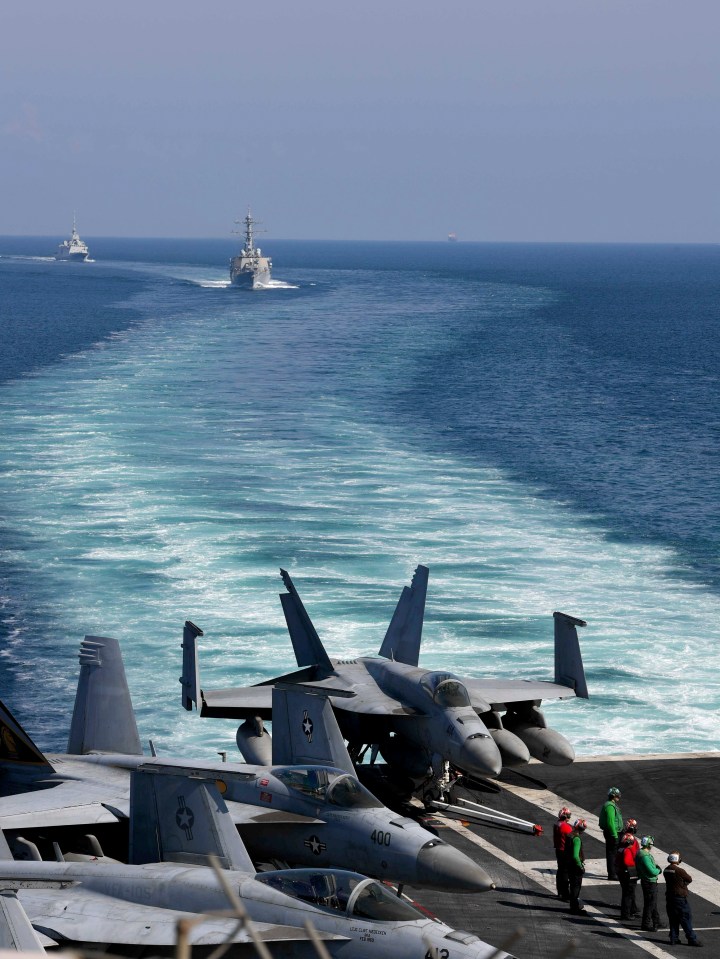 The USS Dwight D. Eisenhower and other warships crossed the Strait on Sunday