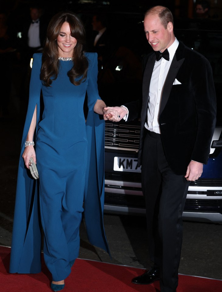 Tonight, defiant Princess Kate and Prince William were all smiles as they carried out their duty greeting celebs at the Royal Variety show