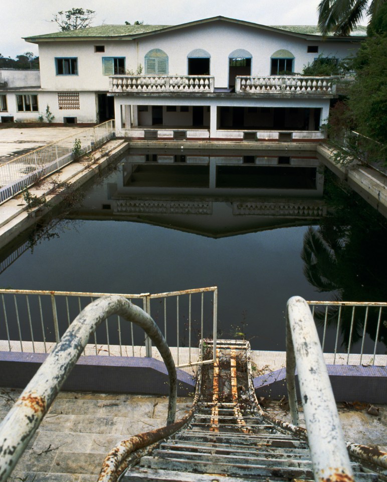 The murky green pool in another tyrant's palace known as Emperor Jean-Bedel Bokassa who was found with frozen bodies, bones and diamond filled chests in his houses