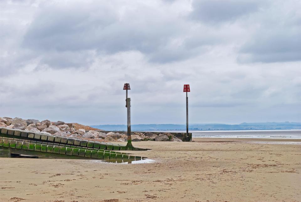 The shingle beach has a large stretch of sand when the tide is out