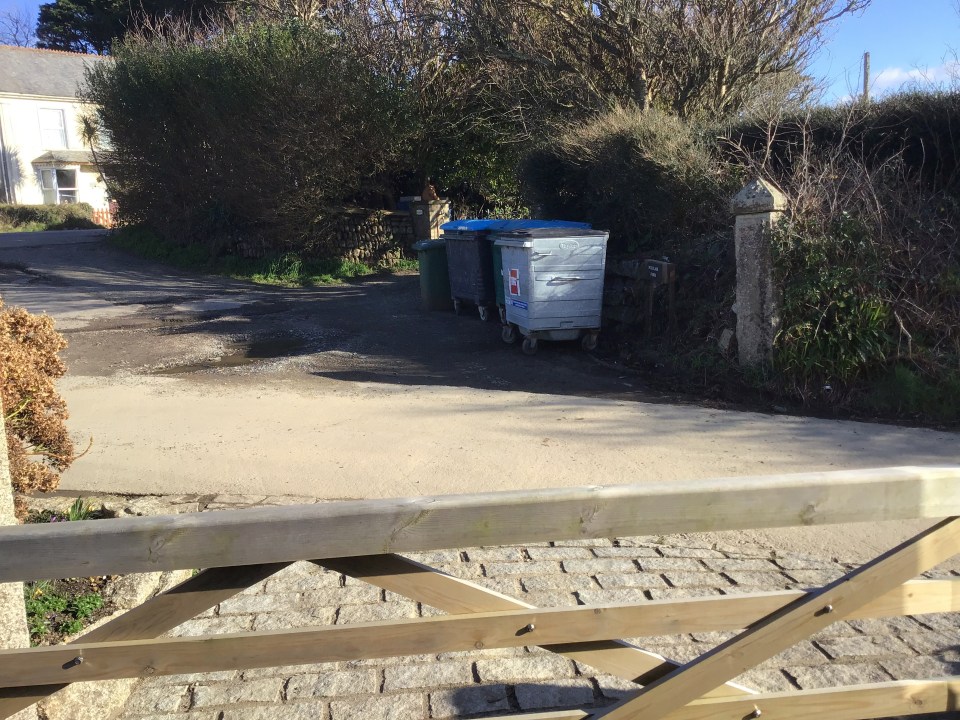 The rubbish sits directly outside the couple's home