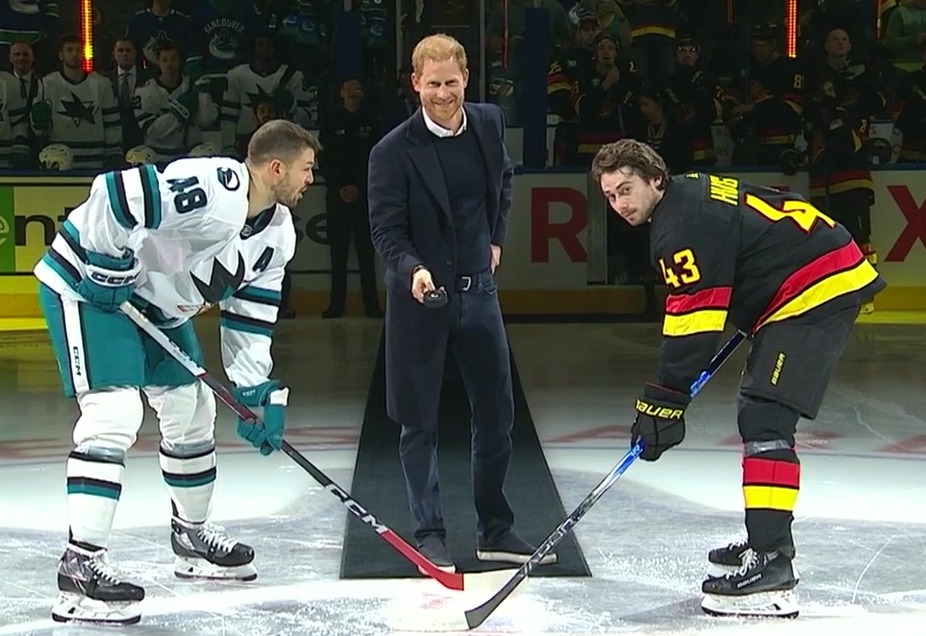 Prince Harry was gently reminded by one of the players after forgetting to drop the puck