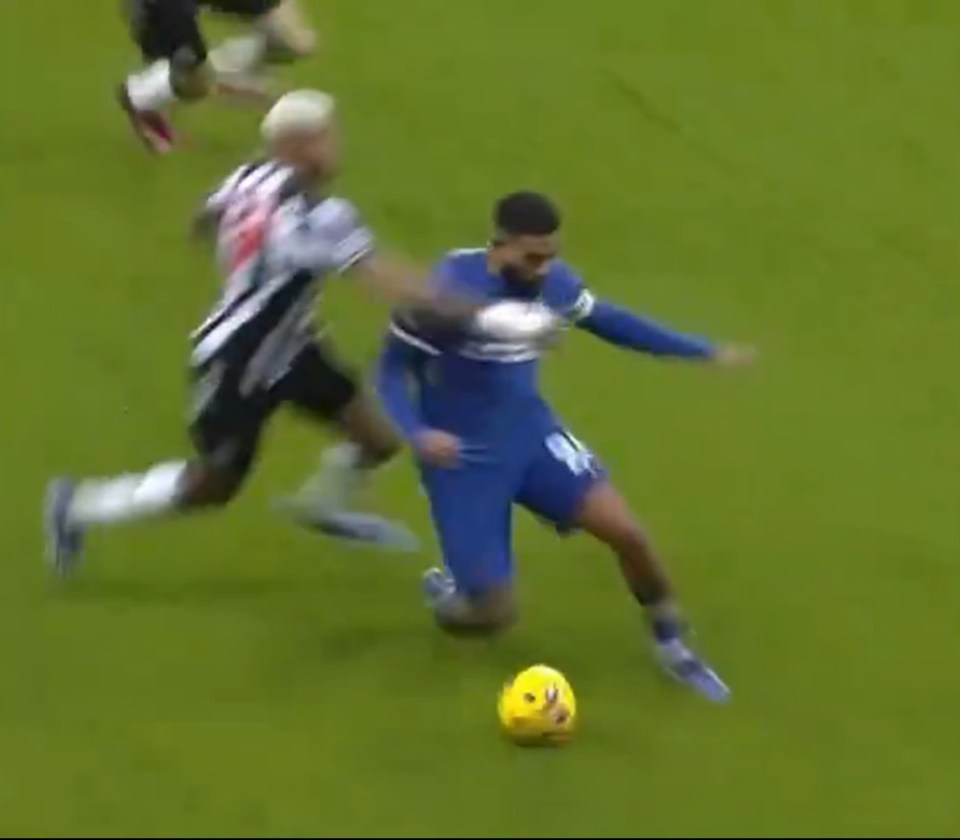 Reece James appears to be clotheslined by Joelinton