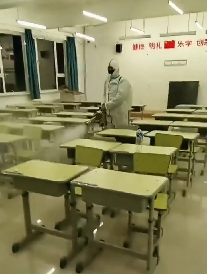 Public health workers wearing full protective gear have been disinfecting classrooms in Sanhe, in China's northern Hebei Province