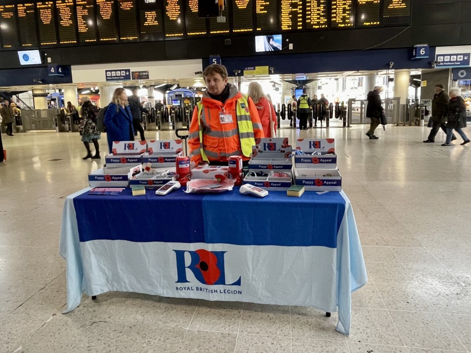 A collecter does his bit at Waterloo - Britain's busiest station