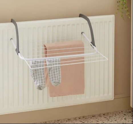 You should never hang wet clothes over the radiator