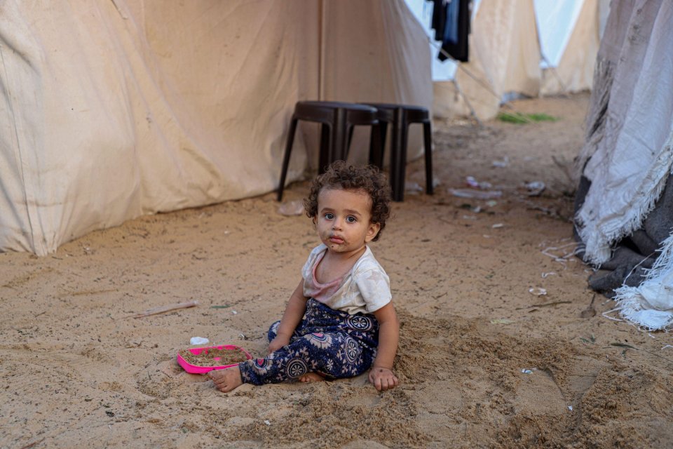 Alamy Live News. 2T4TG9Y (231101) -- GAZA, Nov. 1, 2023 (Xinhua) -- A Palestinian child is seen at a camp affiliated with the United Nations Relief and Works Agency for Palestine Refugees in the Near East (UNRWA) in the southern Gaza Strip city of Khan Younis, on Nov. 1, 2023. The latest figures released by UNRWA, which has around 13,000 staff working in Gaza, put the extent of the humanitarian crisis into stark relief. The agency said 670,000 internally displaced people are sheltering in 150 UNRWA installations. (Photo by Rizek Abdeljawad/Xinhua) This is an Alamy Live News image and may not be part of your current Alamy deal . If you are unsure, please contact our sales team to check.