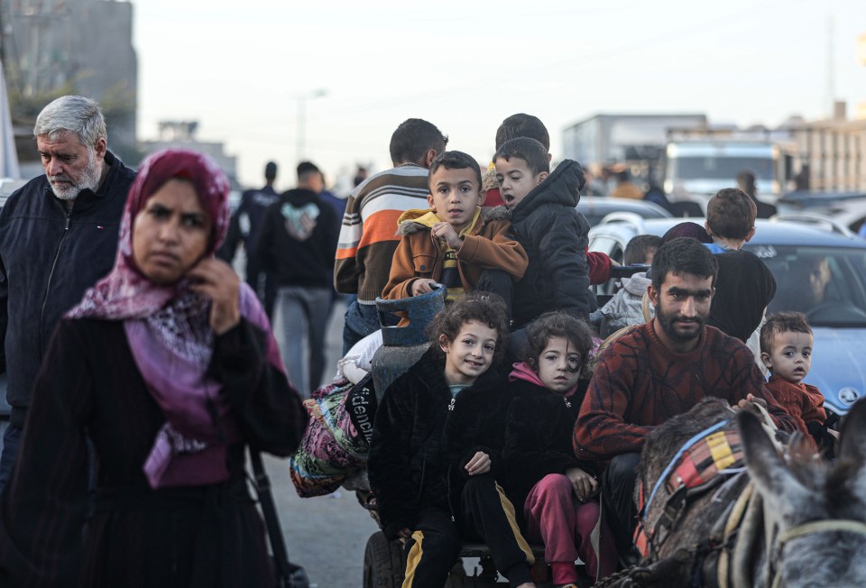 Displaced Palestinians returning to Gaza after Israel declared a 4-day humanitarian pause for a prisoner exchange and to allow aid convoys to help civilians