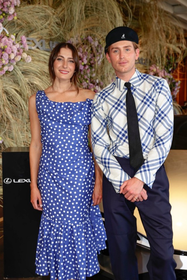 Australian fashion stylist Elliot Garnaut poses alongside entrepreneur Rebecca Harding