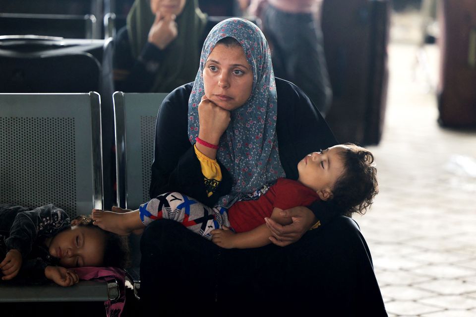 Civilians leaving Gaza wait as dual national Palestinians and foreigners prepare to cross the Rafah border point with Egypt, in the southern Gaza Strip, on November 2, 2023. Egypt will help evacuate "about 7,000" foreigners and dual nationals from the war-ravaged Gaza Strip, the foreign ministry said, with officials saying some 400 people were expected to cross on November 2. (Photo by SAID KHATIB / AFP) (Photo by SAID KHATIB/AFP via Getty Images)